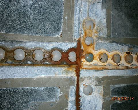 Corrosion-around-the-bolts-holding-the-steel-panels-of-the-fire-sprinkler-tank-together.