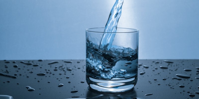 water from water tank being poured into glass